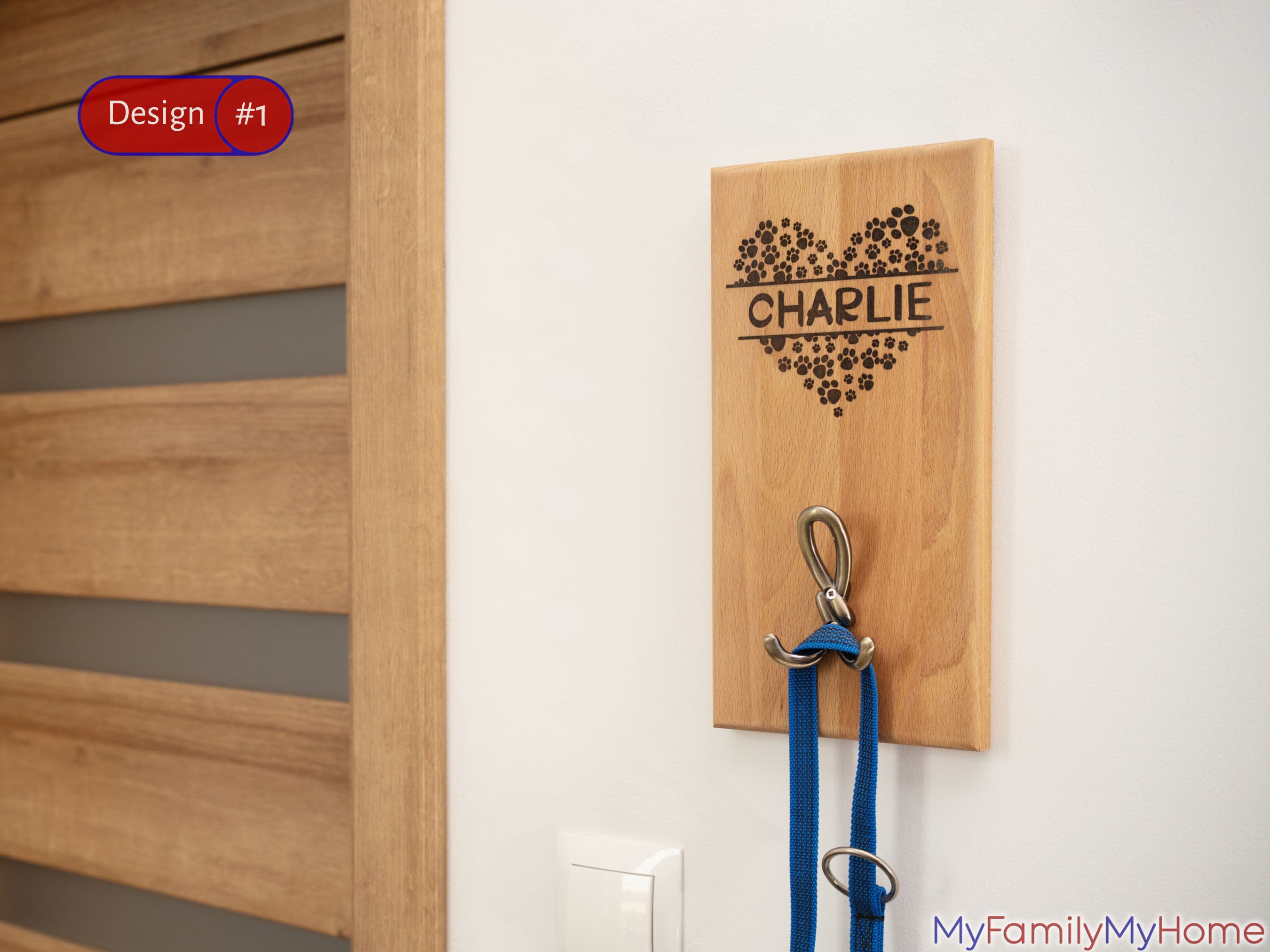 Custom Dog Leash Holder with Personalized Engraving featuring the name 'Charlie' and floral heart design, mounted on wall with metal hooks.