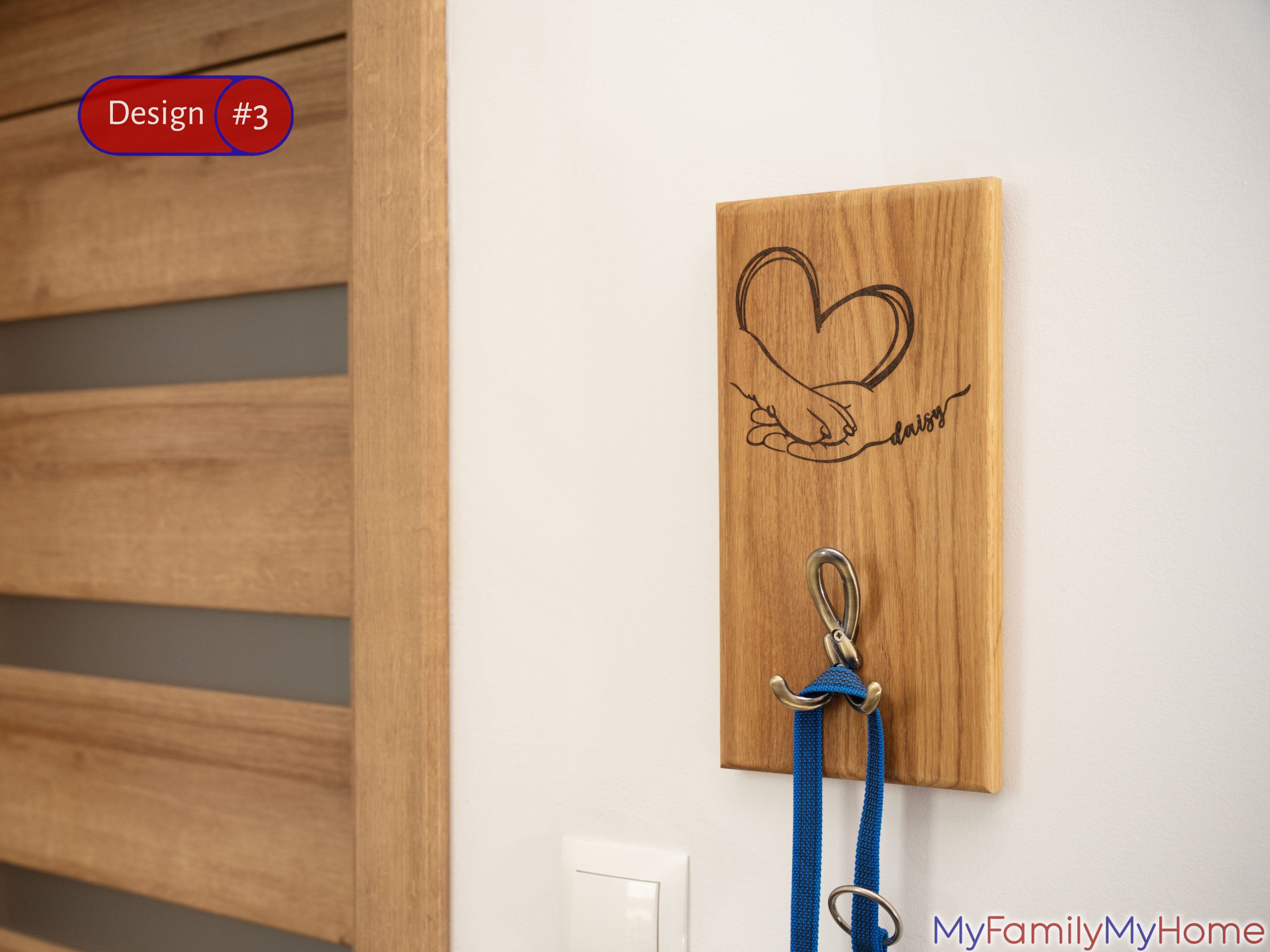 Engraved Wooden Custom Dog Leash Holder for Wall Mount with heart and paw design, featuring metal hook and blue leash in modern entryway.