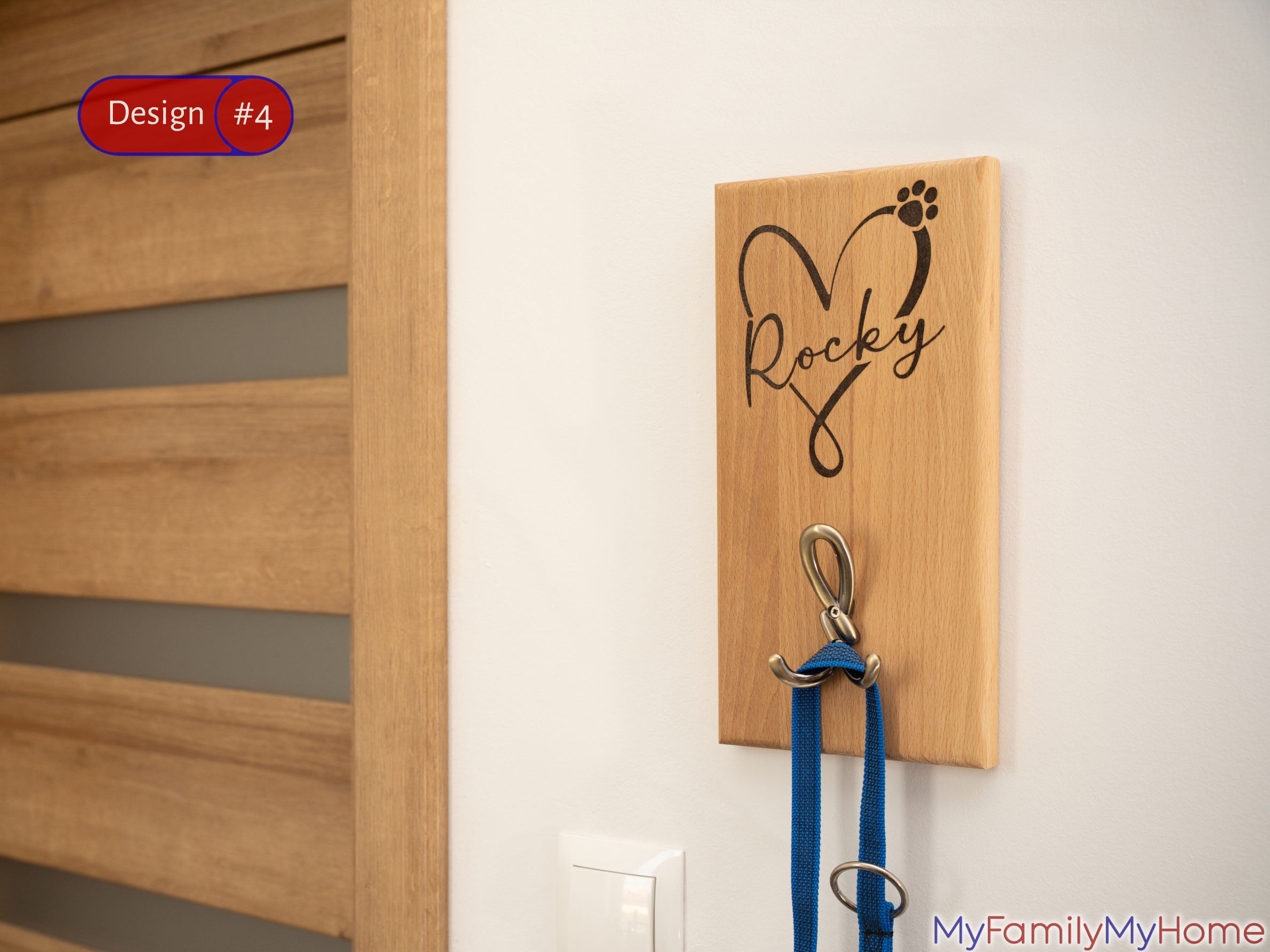 Wall Mounted Custom Wooden Leash Holder with Dog's Name 'Rocky' in heart design and two metal hooks for leash storage. Ideal for pet lovers' home decor.