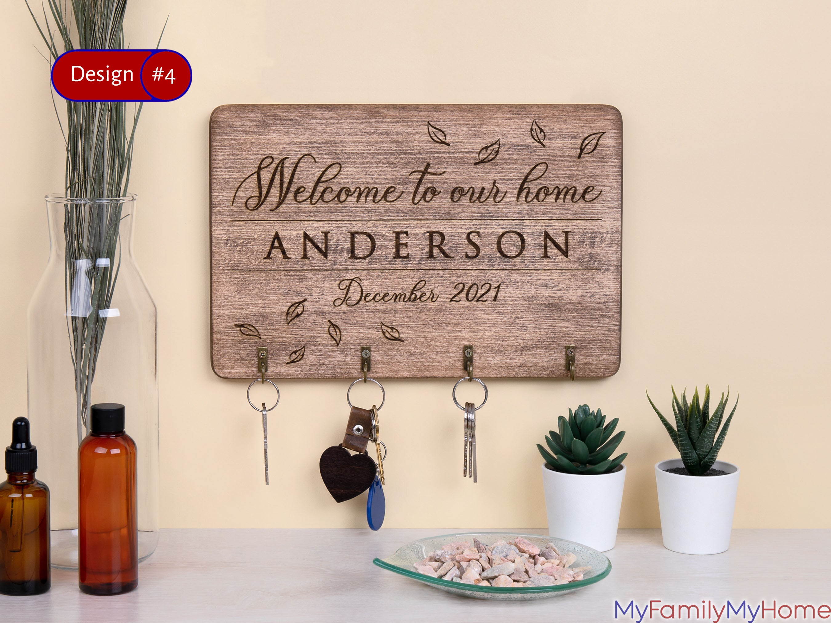 Engraved key holder for wall with custom family name 'Anderson' and 'Welcome to our home' text, ideal for entryway decor and key organization.