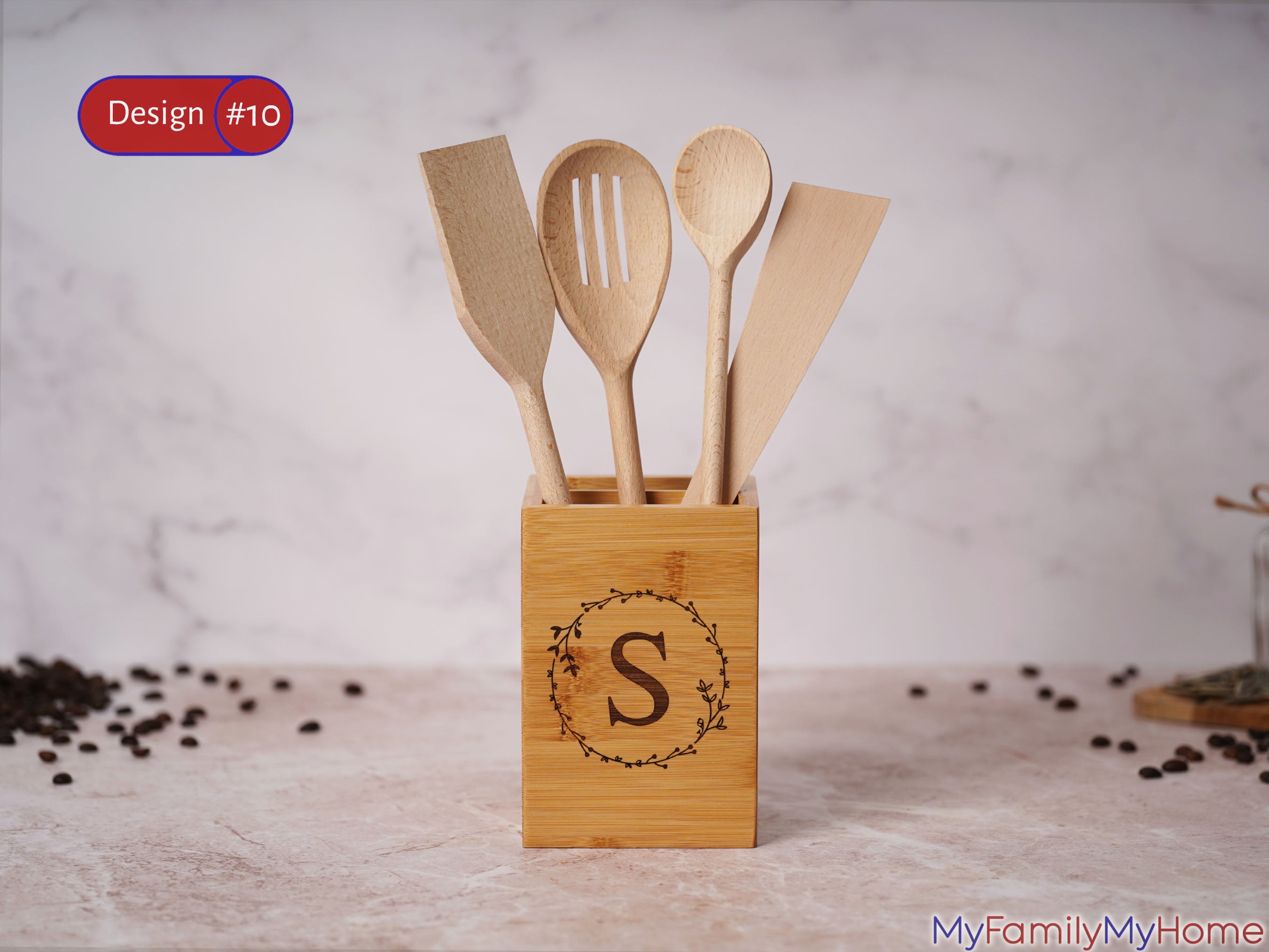 Monogrammed bamboo utensil holder for kitchen with letter 'S' and wooden utensils, ideal for countertop organization and gifting.
